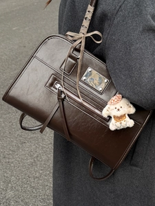 Retro dark brown crossbody handbag with checkered ribbon and plush dog charm