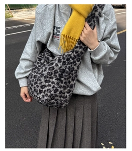 Close-up of leopard print wool shoulder bag with soft texture and adjustable strap