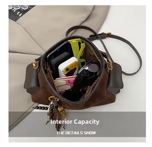 Internal view of the brown suede crossbody bag showing spacious capacity for essentials