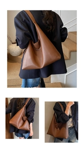Detail view of large brown pebble leather hobo bag with a wide shoulder strap