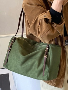 Deep green suede tote bag with brown leather straps and vintage gold chain accents