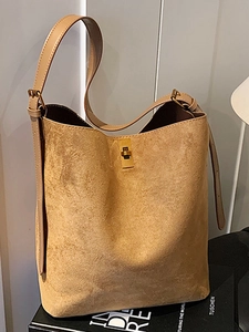 Brown suede leather bucket tote bag with gold metal twist lock and adjustable shoulder strap