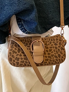 Vintage leopard print shoulder bag with adjustable strap and retro buckle detail