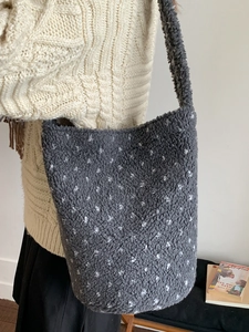 Minimalist grey faux shearling tote bag with white polka dots for autumn commuting