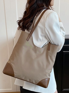 Minimalist large khaki nylon tote bag with brown leather trim for autumn fashion commuting