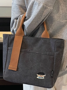 Sac fourre-tout en toile gris foncé avec anses tressées brunes et broderie dessin animé