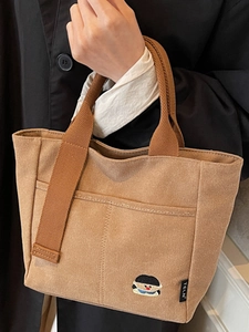 Sac fourre-tout en toile marron avec broderie cartoon et poche avant pour le quotidien