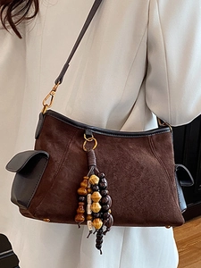 Brown suede crossbody bag with colorful beaded tassels and side flap pockets for women