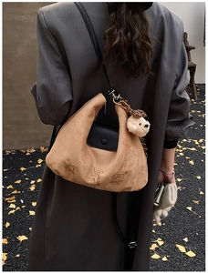 Brown suede underarm bag with cute cartoon embroidery and black leather flap details