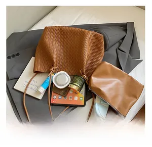 Brown woven tote bag with matching pouch showing spacious interior and storage capacity