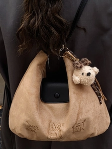Brown faux suede hobo tote bag for women with black pocket and cute dog charm decoration