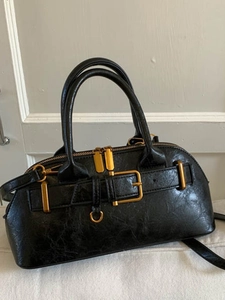 Retro black leather handbag with gold metal buckles and stylish twin handles in 2025 style