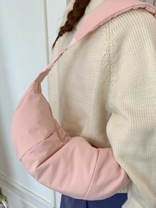 Pink quilted nylon cloud crossbody bag with wide shoulder strap for women