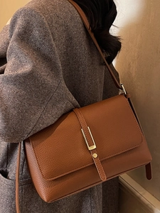 Classic brown leather shoulder bag with vintage gold metal clasp and pebble texture