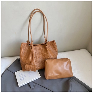 Detailed view of brown woven tote bag 3-piece set with a zipper pouch and coin purse
