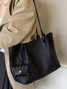 Fashionable black woven large tote bag with a small pouch and slim shoulder straps
