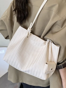 Minimalist white woven tote bag for women with matching mini pouch and shoulder straps