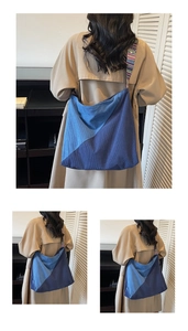 Close-up of the corduroy tote bag featuring blue color-blocking and ethnic style strap