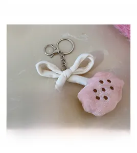 Detail of plush cloud keychain with OPEN MY LOVE embroidery and silver lobster clasp