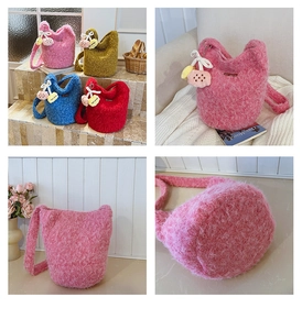 Detail view of plush knit bucket bags in four colors with cute biscuit and heart charms