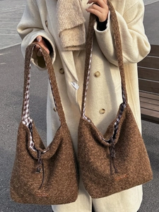 Vintage brown fuzzy crossbody tote bag with drawstring closure and warm fleece texture