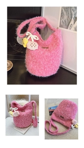 Detailed close-up of pink faux fur bucket bag with cute plush charms and leather label