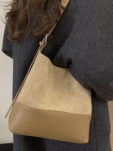 Vintage suede bucket shoulder bag in khaki with adjustable strap and leather trim