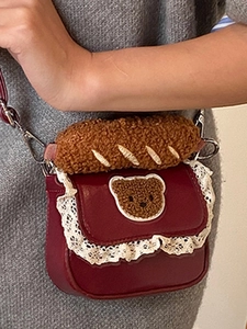 Mini burgundy crossbody bag with white lace trim and large plush baguette bread decor