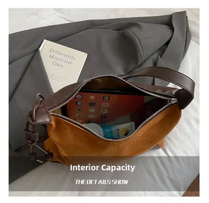 Top view of suede shoulder bag showing large capacity for tablet and cosmetics