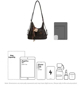 Black leather hobo bag capacity detail showing storage for 11 inch tablet and smartphone