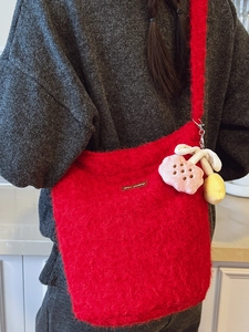 Cute red plush bucket bag for women with floral charms and spacious fluffy design