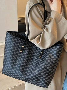 Minimalist large-capacity tote bag with grey monogram print and gold rivet hardware