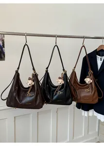 Detailed view of large hobo tote bags in dark coffee, black and tan colors