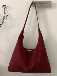 Large burgundy faux suede hobo tote bag for women featuring a minimalist vertical stitch design