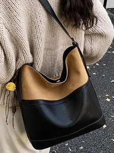 Retro contrast bucket bag in camel frosted texture and black leather with flower charm