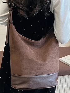 Vintage brown matte leather large shoulder bag for women shown in a casual daily setting