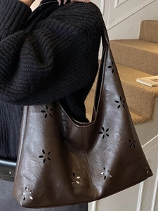 Deep coffee large-capacity cutout tote bag with laser-cut floral patterns in PU leather