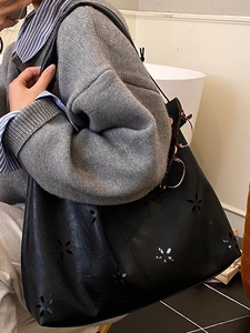 Large black tote bag with laser-cut floral pattern for women stylish commuter shoulder bag