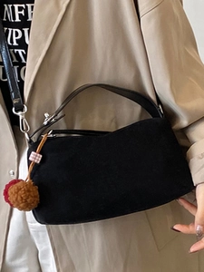 Vintage black frosted matte underarm bag with a decorative plush pom-pom charm