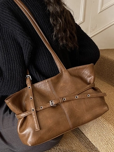 Vintage brown PU leather tote bag with metallic buckle and spacious design for daily commute