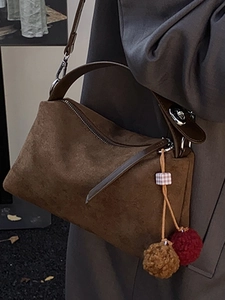 Retro dark brown suede underarm bag with decorative pompom and metal chain strap