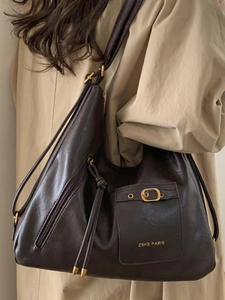 Fashionable dark brown leather hobo tote bag with metal buckle and side zipper details