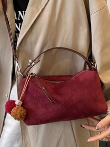Retro burgundy matte suede shoulder bag with plush ball charms and long strap for women