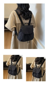 Detail of Youth Bear embossed logo on black nylon drawstring backpack flap