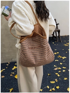Detail of the chic wool plaid tote bag featuring bonne journée embroidery in autumn setting