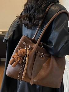 Retro brown large capacity tote bag with bear charm and metallic brand logo detail