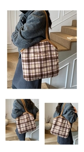 Detail of vintage plaid tote bag featuring Bonne journée embroidery and fabric texture