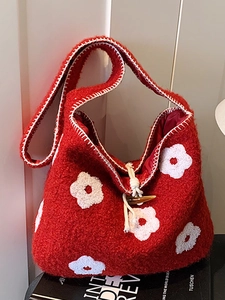 Winter plush tote bag with white flower embroidery and horn buckle closure in red