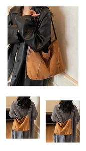 Detail view of brown suede hobo tote bag with spacious interior and matching shoulder strap