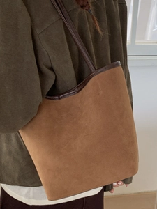 Brown faux suede large capacity bucket tote bag with leather straps for daily commute